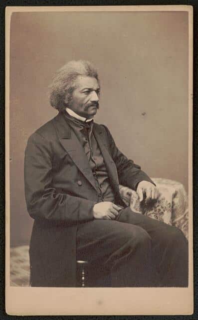 Frederick Douglass, three-quarter length portrait, seated