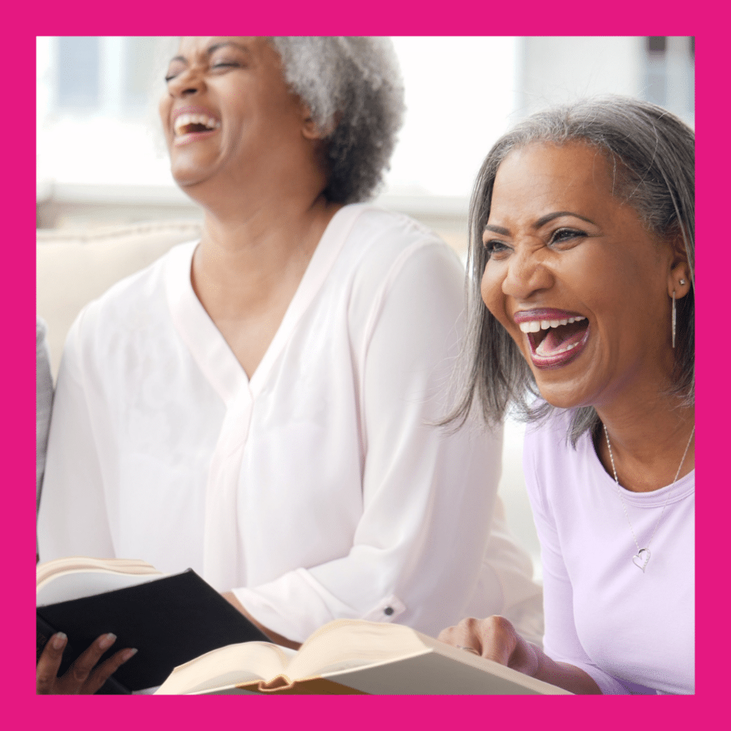 women laughing with life story books